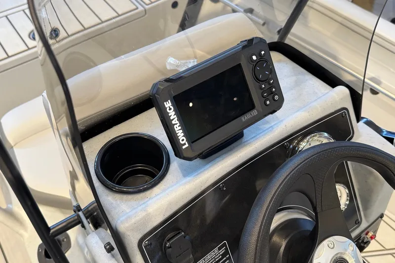 Slide: The Image of 2027 Tracker Bass Tracker 175 CC dashboard with Lowrance fish finder and steering wheel. - 22
