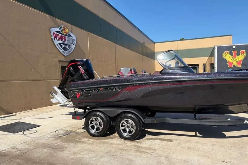 Slide: The Image of 2027 Nitro ZV19 Pro boat on trailer outside Power Pros shop. - 1