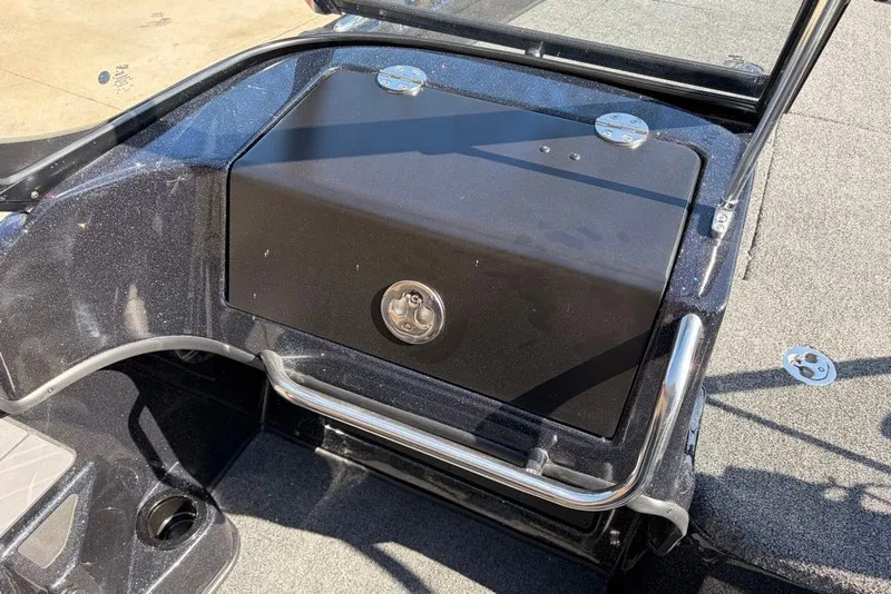 Slide: The Image of 2027 Nitro ZV19 Pro boat storage compartment with sleek black finish and sturdy metal handle. - 9