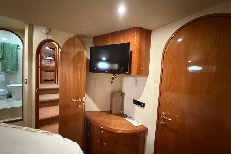 Slide: The Image of Luxurious interior of 2004 Neptunus 56 Flybridge yacht with wood finishes and modern amenities. - 41