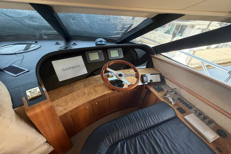 Slide: The Image of Helm of 2004 Neptunus 56 Flybridge yacht with Garmin navigation system. - 29
