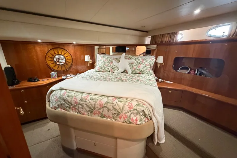 Slide: The Image of Luxurious bedroom interior of 2004 Neptunus 56 Flybridge yacht with elegant wood finishes. - 35