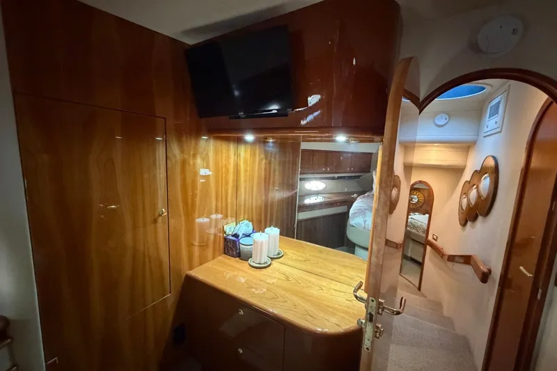 Slide: The Image of Luxurious interior of 2004 Neptunus 56 Flybridge yacht with wood finish and modern amenities. - 45