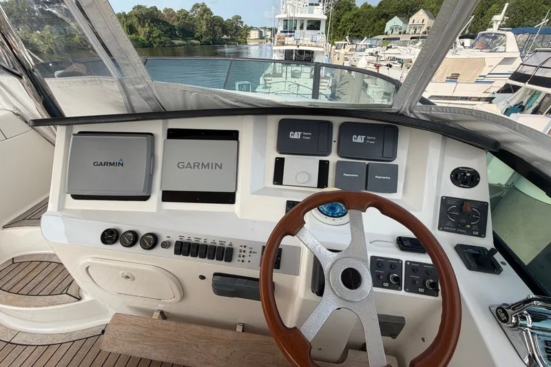 Slide: The Image of Helm of 2004 Neptunus 56 Flybridge with Garmin navigation systems and CAT Marine Power controls. - 14