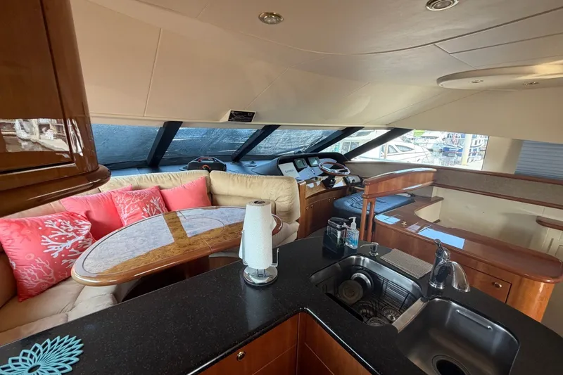 Slide: The Image of Luxurious interior of 2004 Neptunus 56 Flybridge yacht with elegant seating and helm. - 26