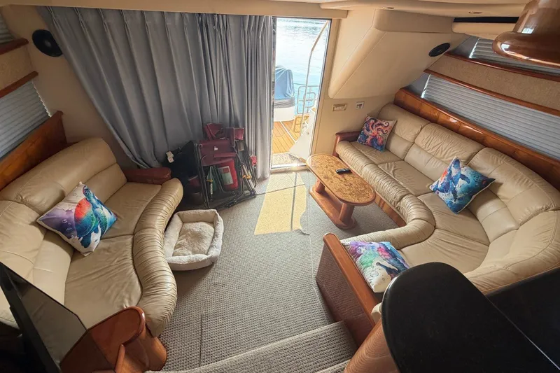 Slide: The Image of Luxurious 2004 Neptunus 56 Flybridge yacht interior with plush seating and vibrant pillows. - 25