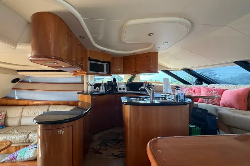 Slide: The Image of Luxurious interior of a 2004 Neptunus 56 Flybridge yacht with modern kitchen and seating area. - 54