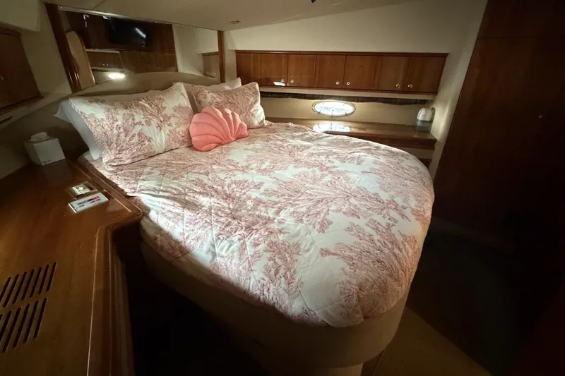 Slide: The Image of Luxurious bedroom interior of 2004 Neptunus 56 Flybridge yacht with elegant bedding. - 44