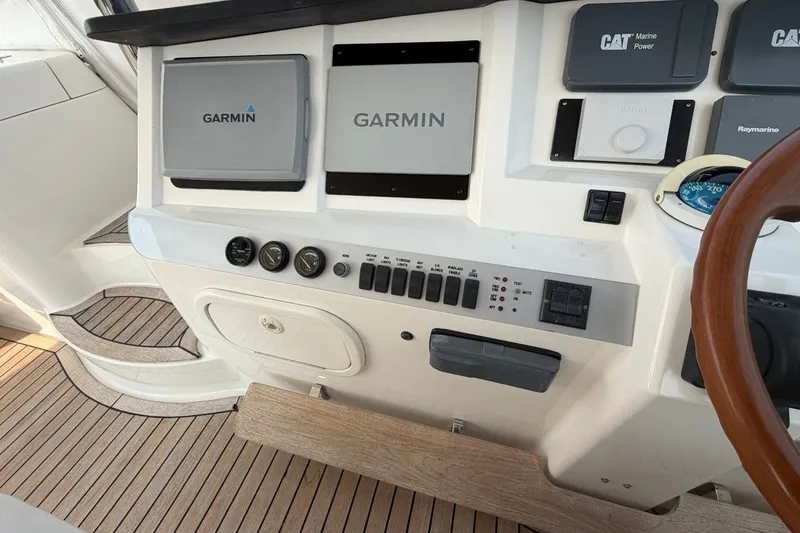 Slide: The Image of Control panel of a 2004 Neptunus 56 Flybridge with Garmin navigation systems. - 16