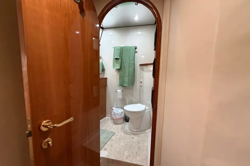 Slide: The Image of Luxurious bathroom interior of 2004 Neptunus 56 Flybridge yacht with wooden door. - 36