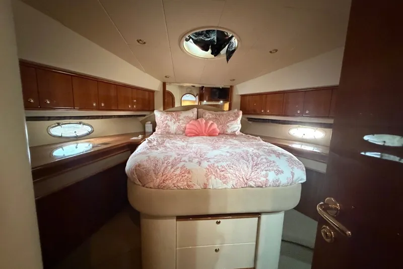 Slide: The Image of Luxurious bedroom interior of 2004 Neptunus 56 Flybridge yacht with elegant wood finishes. - 50