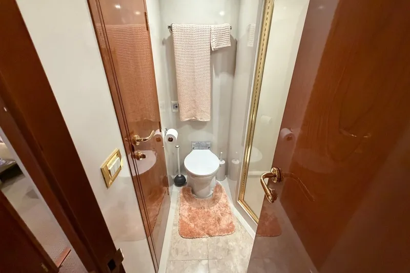 Slide: The Image of Luxurious bathroom on 2004 Neptunus 56 Flybridge yacht with elegant wood finishes. - 48