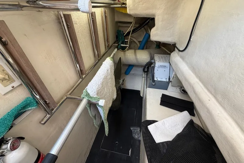 Slide: The Image of Engine room of 2004 Neptunus 56 Flybridge yacht, featuring equipment and storage. - 57