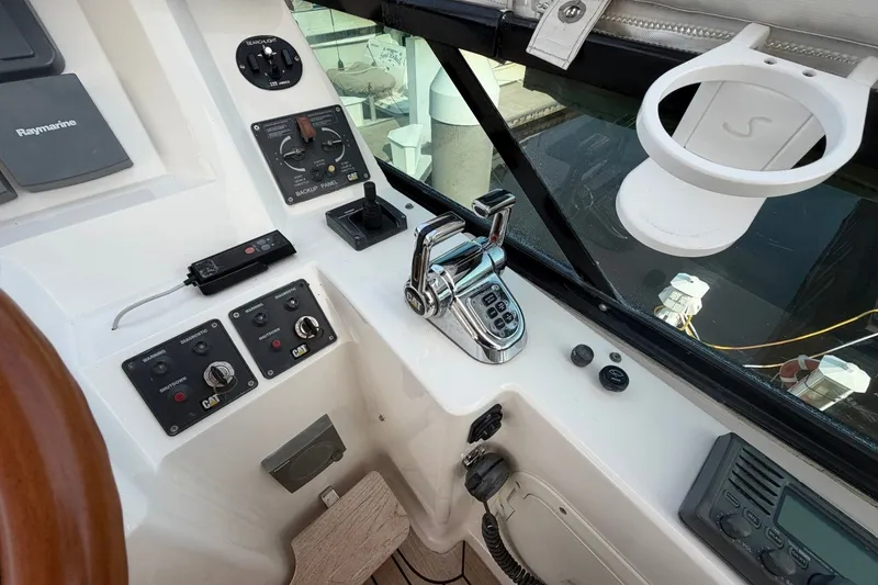 Slide: The Image of Control panel of a 2004 Neptunus 56 Flybridge yacht with navigation equipment. - 15