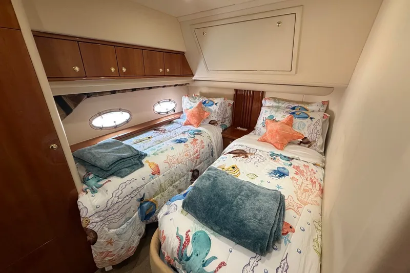 Slide: The Image of Twin cabin with nautical-themed bedding in a 2004 Neptunus 56 Flybridge yacht. - 42