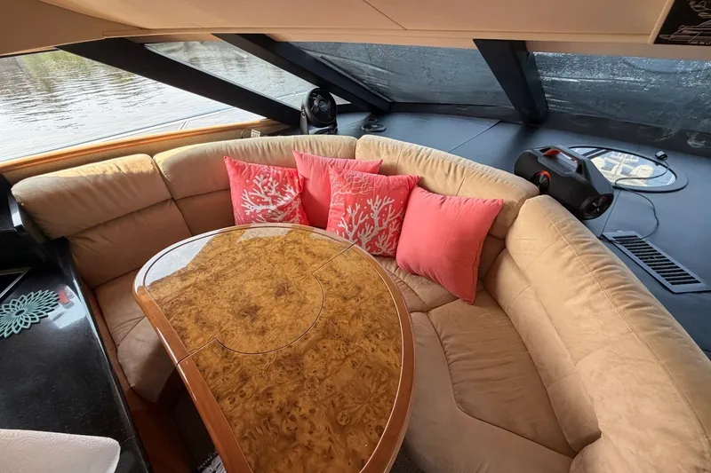 Slide: The Image of Luxurious interior of 2004 Neptunus 56 Flybridge yacht with plush seating and elegant table. - 31