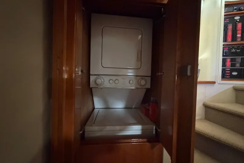 Slide: The Image of Stacked washer and dryer in 2004 Neptunus 56 Flybridge yacht interior. - 53