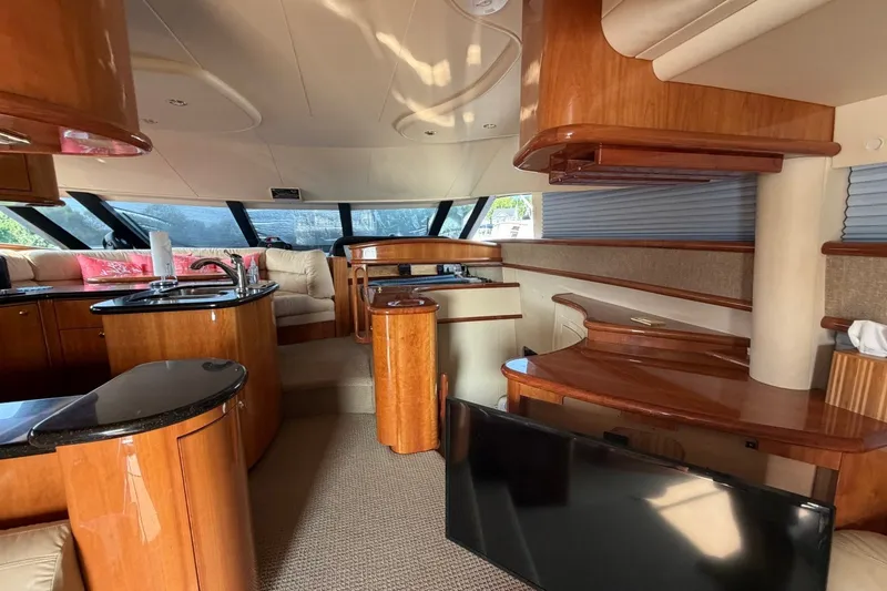 Slide: The Image of Luxurious interior of a 2004 Neptunus 56 Flybridge yacht with elegant wood finishes. - 23