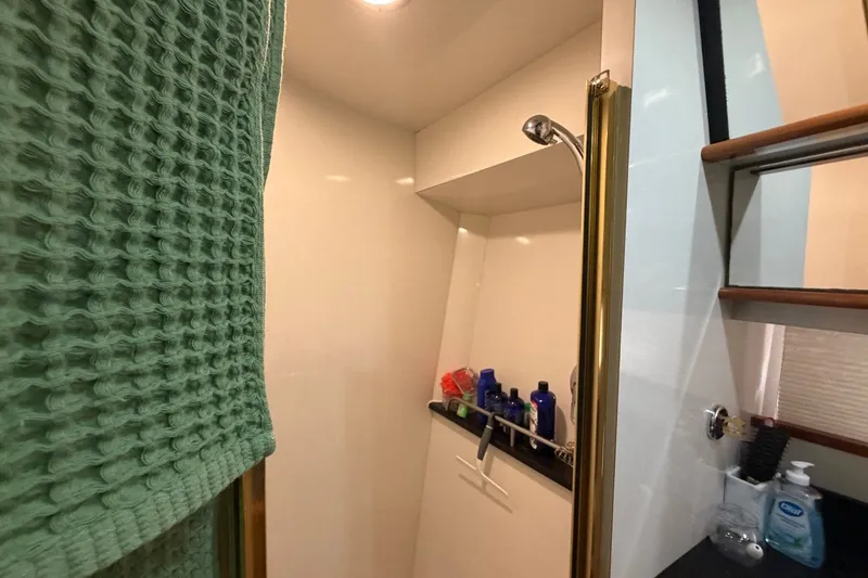 Slide: The Image of Bathroom interior of 2004 Neptunus 56 Flybridge yacht with shower and toiletries. - 38