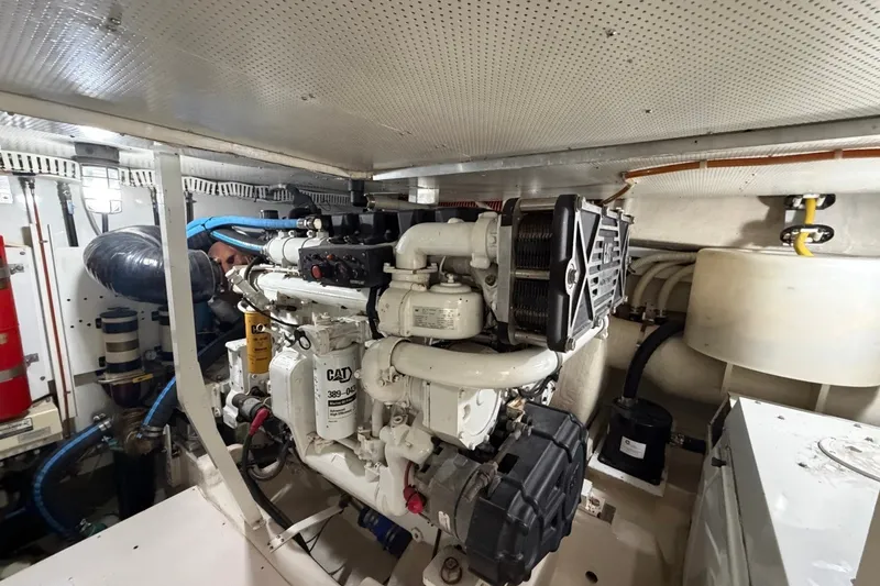 Slide: The Image of Engine room of 2004 Neptunus 56 Flybridge yacht, featuring CAT marine engine. - 59