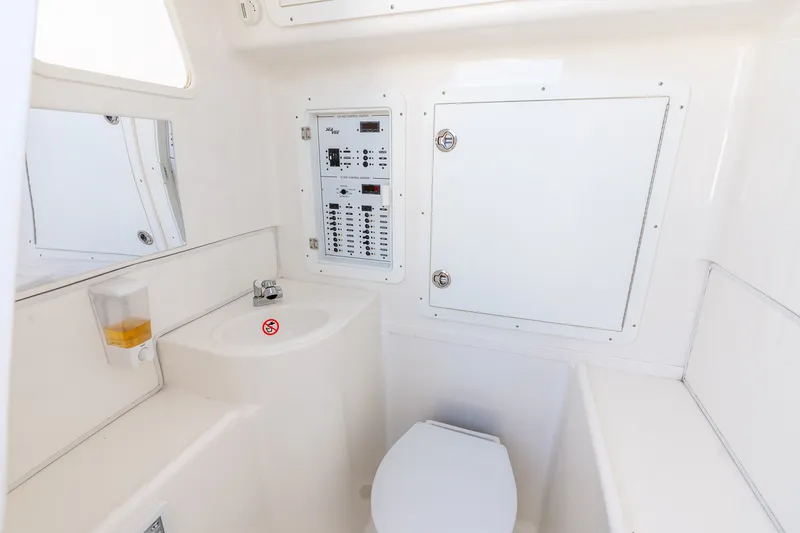 Slide: The Image of 2023 SeaVee 370Z boat interior with sink, toilet, and control panel. - 24
