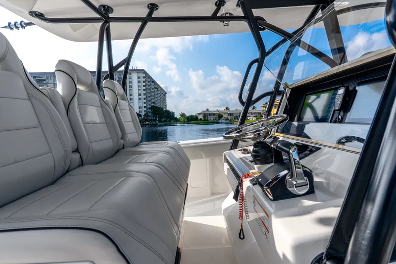 Slide: The Image of 2023 SeaVee 370Z boat interior with modern helm and luxurious seating. - 42