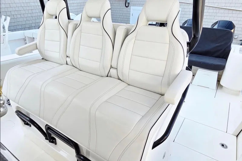 Slide: The Image of 2023 SeaVee 370Z boat with luxurious white seating and modern design. - 7