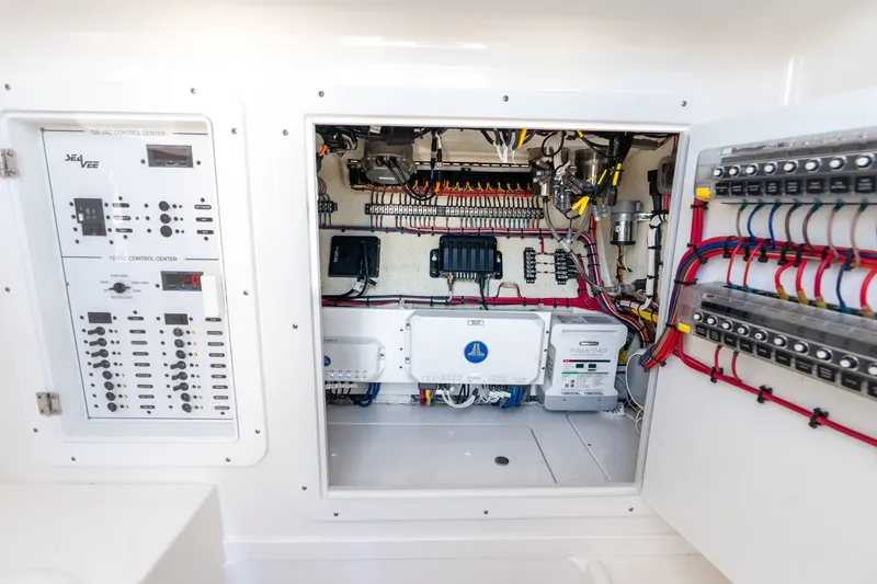 Slide: The Image of Electrical control panel of 2023 SeaVee 370Z boat, showcasing wiring and components. - 26