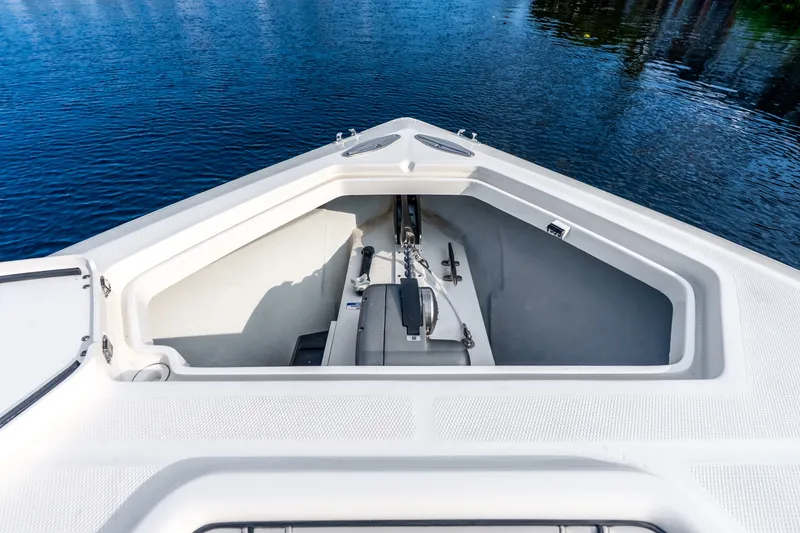 Slide: The Image of Bow view of 2023 SeaVee 370Z boat with anchor compartment open. - 35