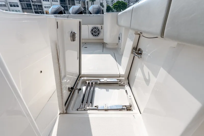 Slide: The Image of 2023 SeaVee 370Z boat interior with open storage compartment and visible seating. - 66