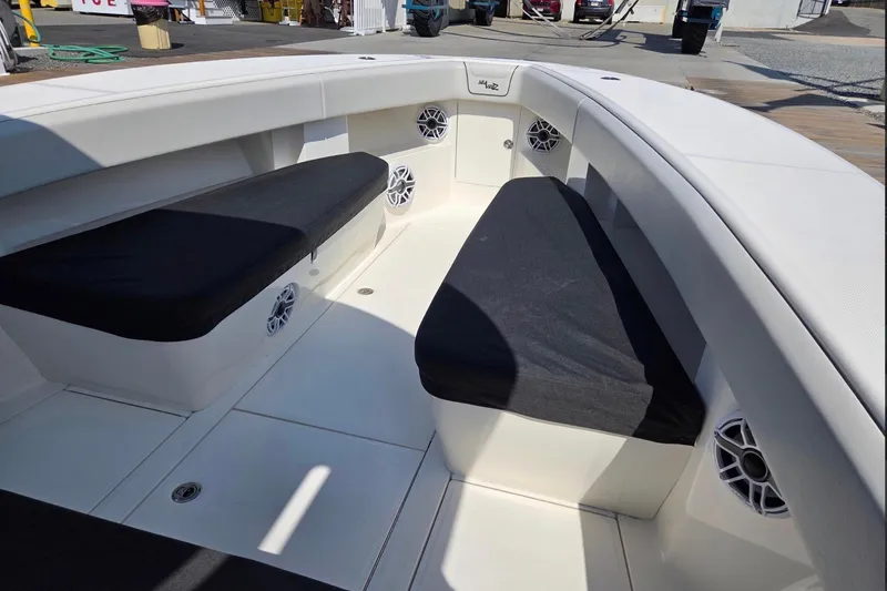 Slide: The Image of 2023 SeaVee 370Z boat interior with cushioned seating and built-in speakers. - 4