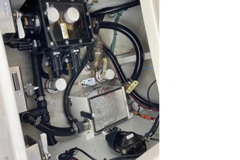 Slide: The Image of Engine compartment of 2023 SeaVee 370Z boat, showcasing intricate mechanical components and wiring. - 10