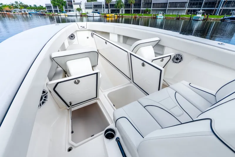 Slide: The Image of 2023 SeaVee 370Z boat interior with open storage compartments and luxurious seating. - 38
