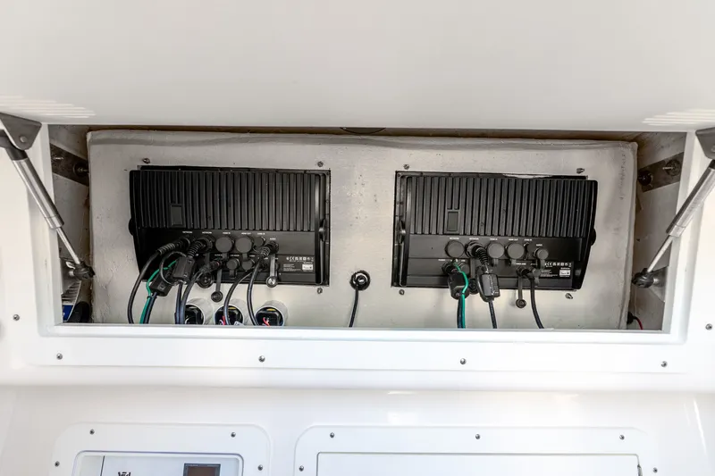 Slide: The Image of 2023 SeaVee 370Z electronics compartment with advanced wiring and equipment. - 25