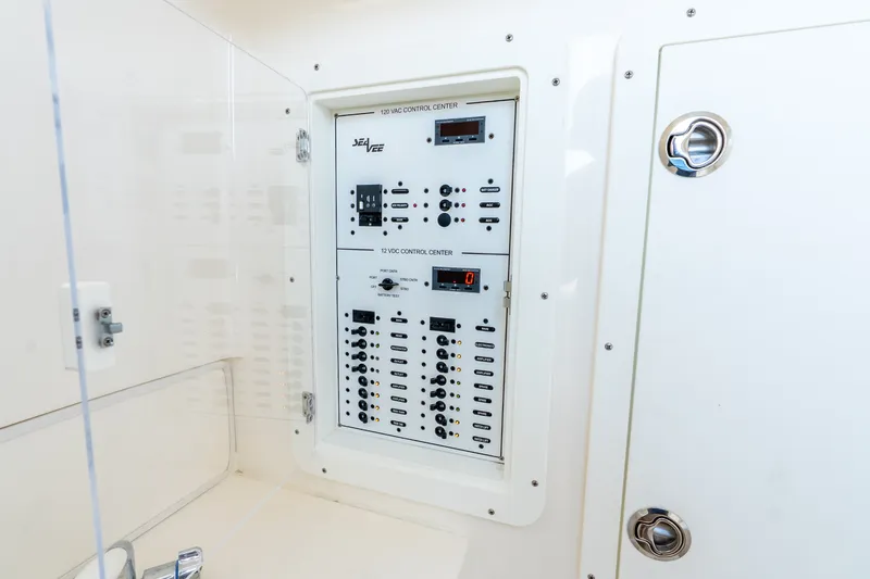 Slide: The Image of Electrical control panel on 2023 SeaVee 370Z boat, featuring switches and indicators. - 28