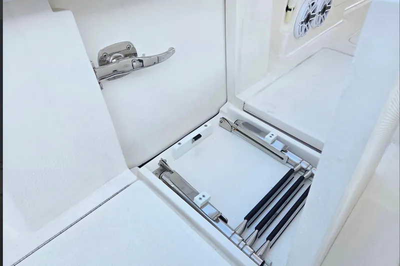 Slide: The Image of 2023 SeaVee 370Z boat compartment with stainless steel hardware and retractable ladder. - 9