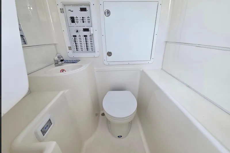 Slide: The Image of 2023 SeaVee 370Z boat interior with toilet and control panel. - 8