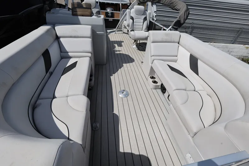 Slide: The Image of 2023 SunCatcher Select 320 RC pontoon boat interior with plush seating and modern design. - 7