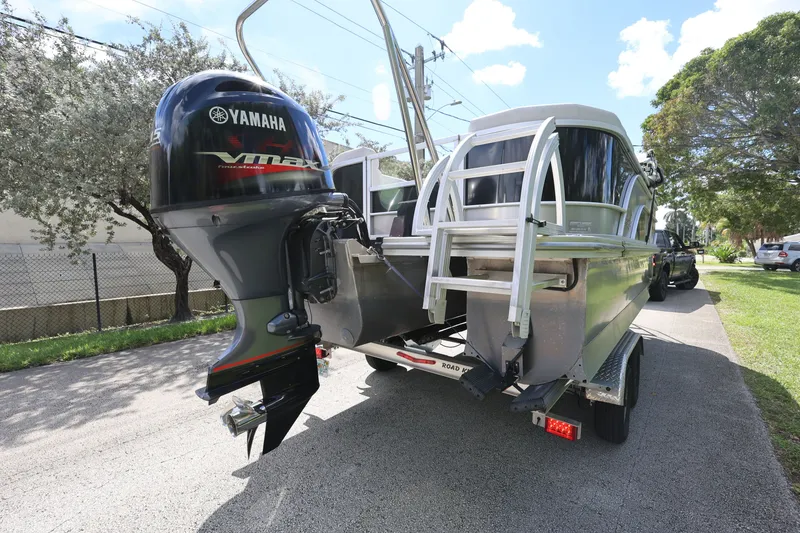Slide: The Image of 2023 SunCatcher Select 320 RC boat with Yamaha VMAX engine on trailer. - 6