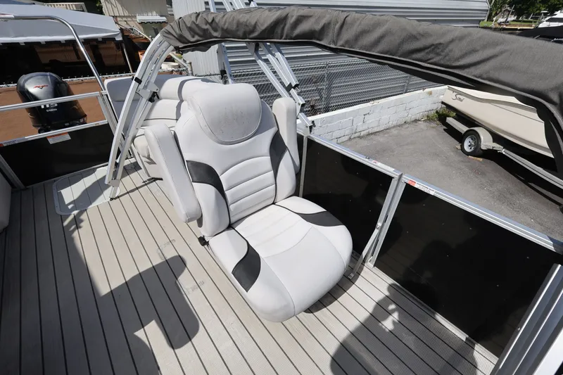 Slide: The Image of 2023 SunCatcher Select 320 RC boat interior with plush seating and sleek design. - 12