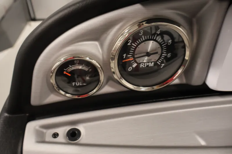 Slide: The Image of Dashboard of 2023 South Bay S222RS showing fuel and RPM gauges. - 18