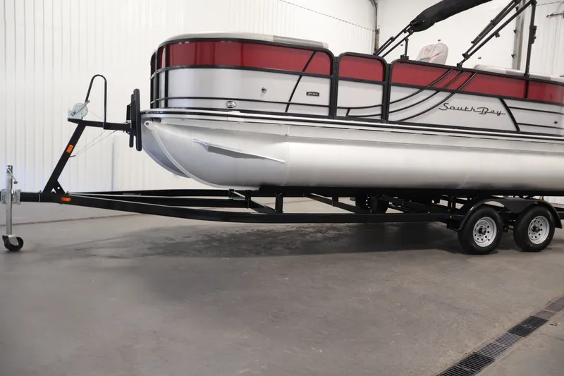 Slide: The Image of 2023 South Bay S222RS pontoon boat on trailer in indoor storage. - 39