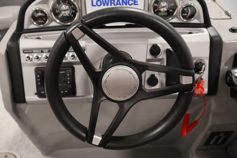 Slide: The Image of 2023 South Bay S222RS boat steering wheel and dashboard controls. - 17