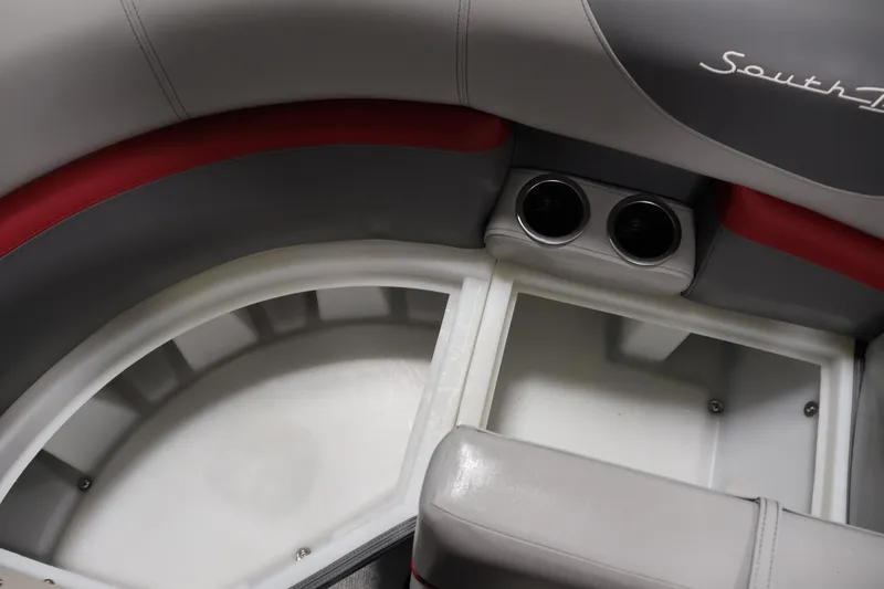 Slide: The Image of Interior of 2023 South Bay S222RS boat with cup holders and storage compartment. - 13