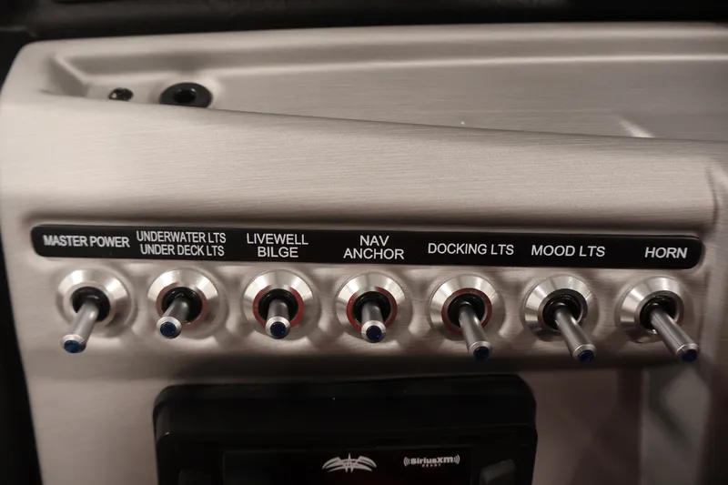 Slide: The Image of Control panel of 2023 South Bay S222RS boat with labeled switches for various functions. - 22