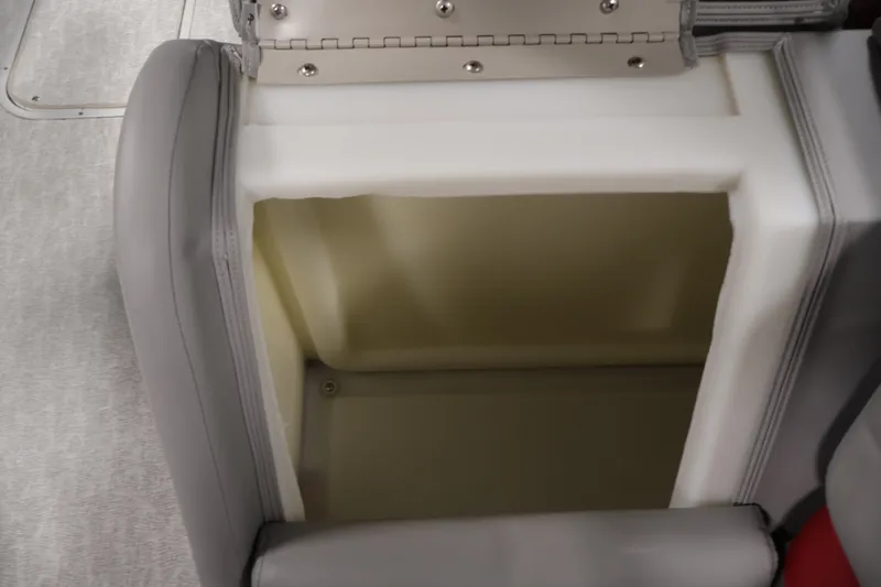 Slide: The Image of 2023 South Bay S222RS boat seat storage compartment, open with visible interior space. - 32
