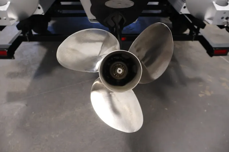 Slide: The Image of Close-up of a 2023 South Bay S222RS boat propeller in a workshop setting. - 36