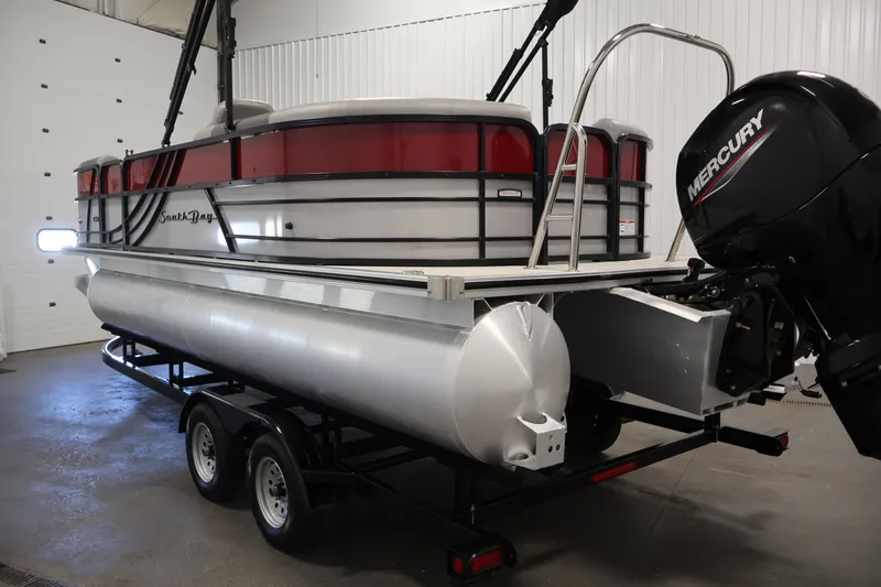 Slide: The Image of 2023 South Bay S222RS pontoon boat with Mercury engine in indoor storage. - 7