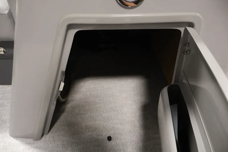 Slide: The Image of Open storage compartment in 2023 South Bay S222RS boat interior. - 15