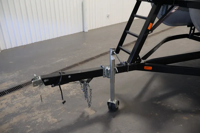 Slide: The Image of Trailer hitch and support wheel of 2023 South Bay S222RS boat trailer. - 38